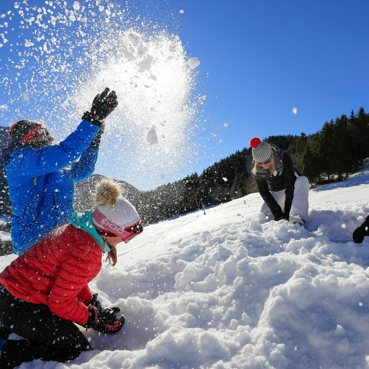 Montmin in France - a group of people playing in the snow.