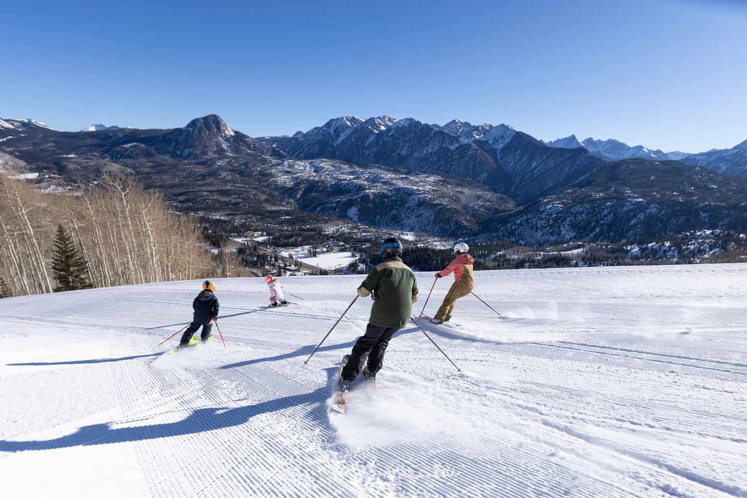 Purgatory – Durango in USA - a group of people skiing down a snowy slope.