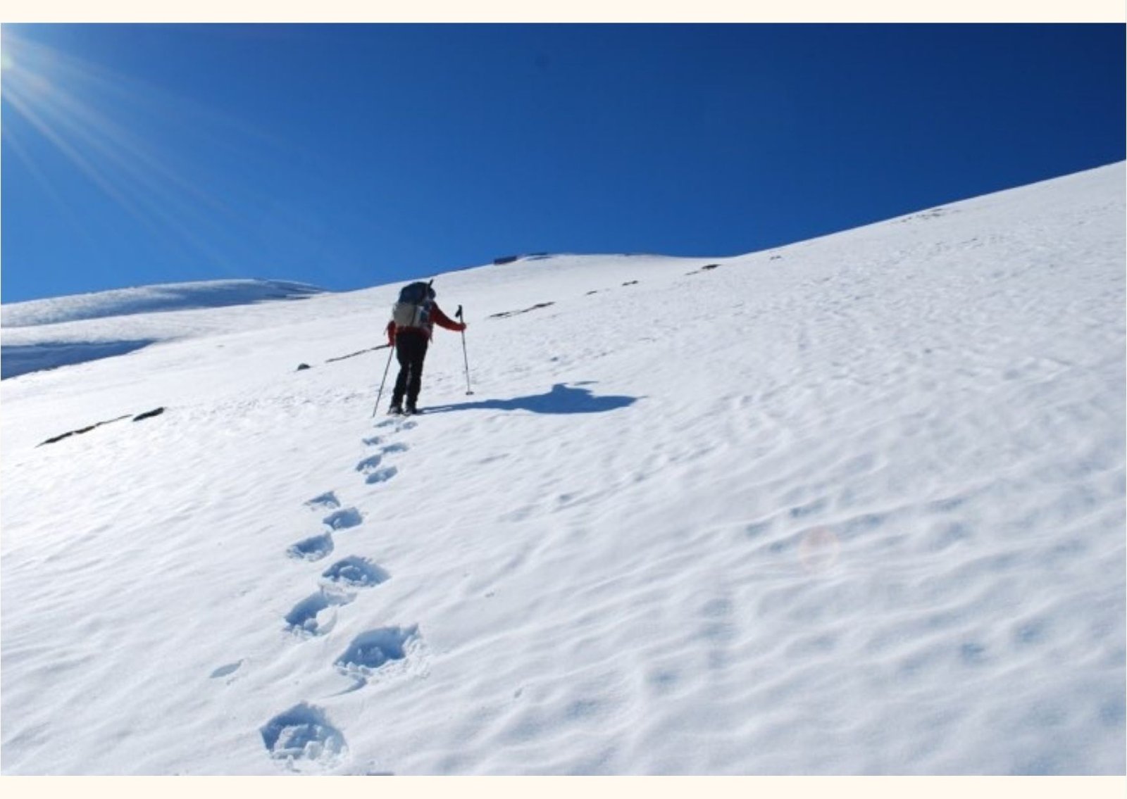 Passo Godi – Scanno in Italy - a person walking up a snow covered mountain.