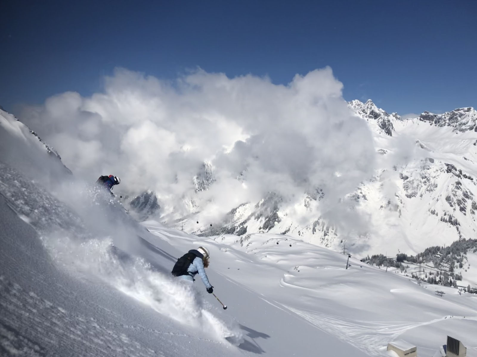 Rifflsee in Austria - a person skiing down the side of a mountain.