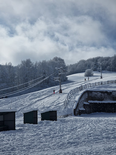 ŠRC Mukinje in Croatia - a snow covered ski slope in the mountains.
