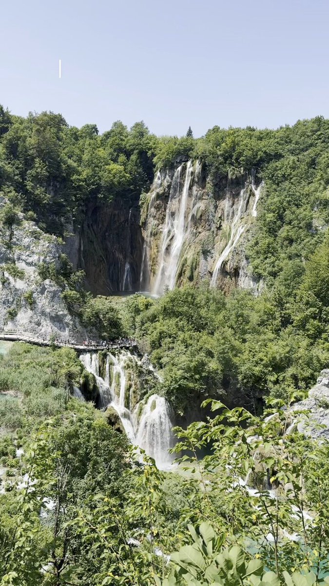ŠRC Mukinje in Croatia - a waterfall in the middle of a forest.
