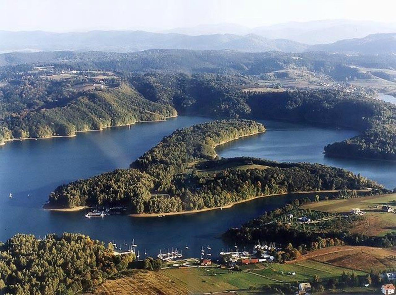 Solina in Poland - a large body of water surrounded by trees.