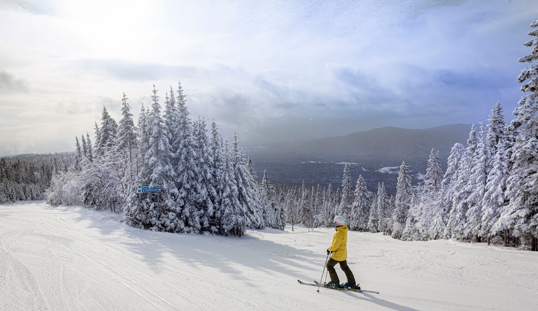 Le Mont Grand-Fonds in Canada - a person on a snowboard going down a hill.