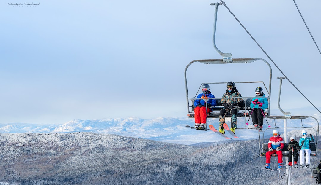 Le Mont Grand-Fonds in Canada - a group of people riding on a ski lift.