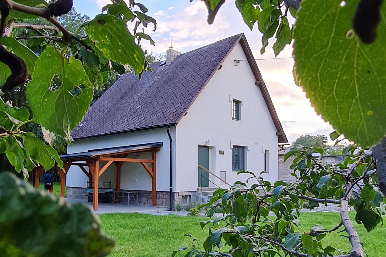 Javorník-Zálesí in Czech Republic - a white house in the middle of a green field.