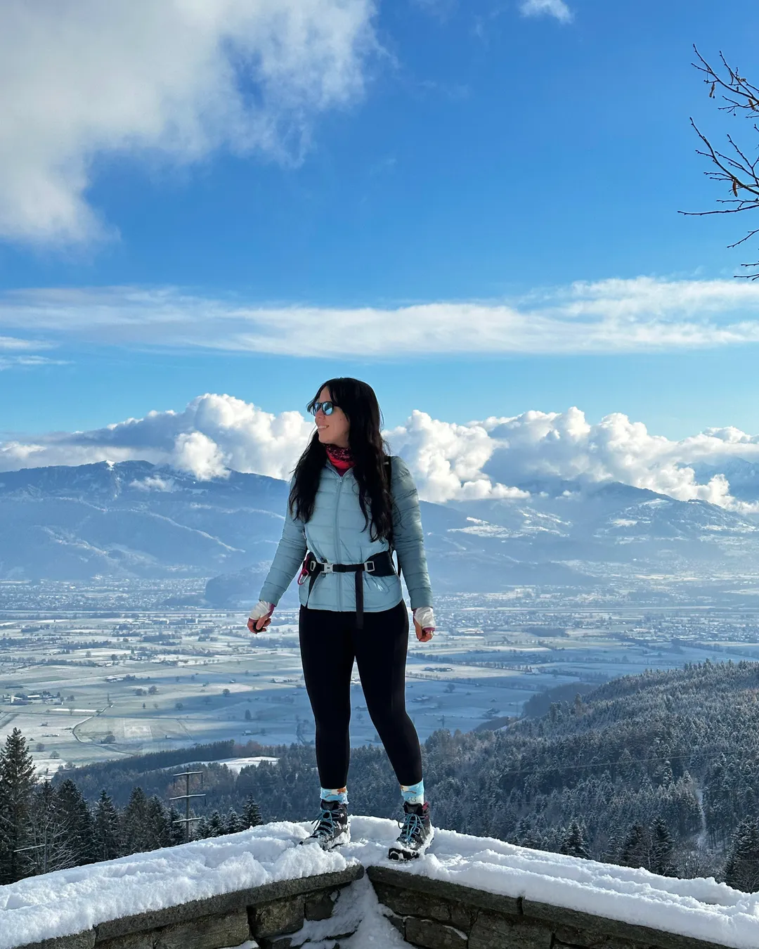 Gais in Switzerland - a woman standing on top of a snow covered mountain.