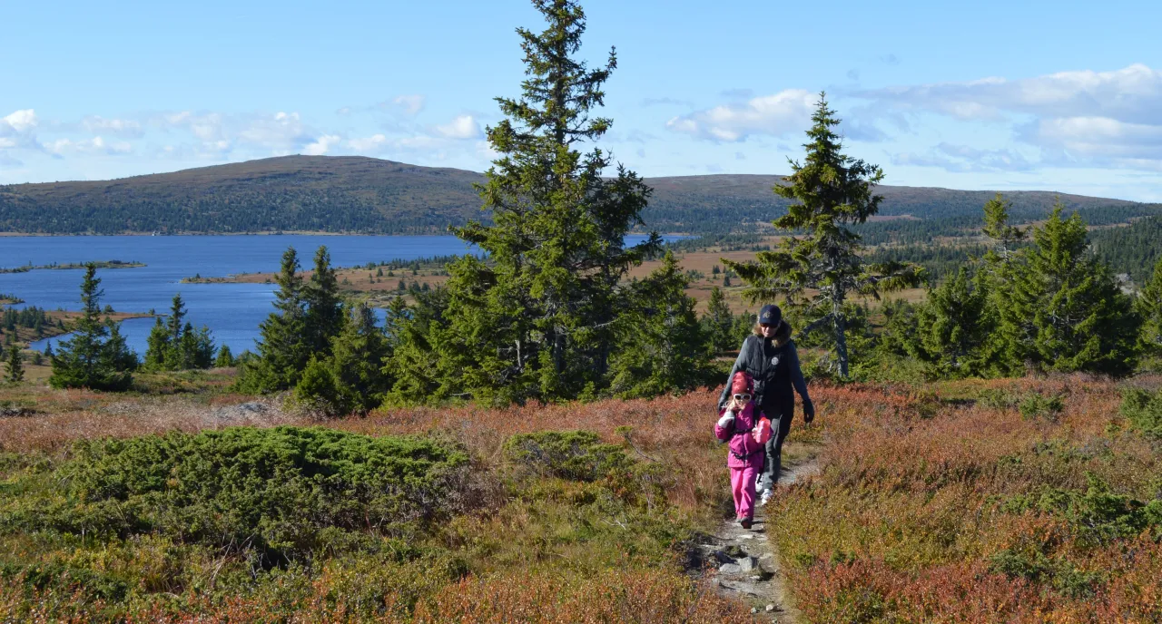Nordseter Skicenter in Norway - a man and a little girl walking on a trail.