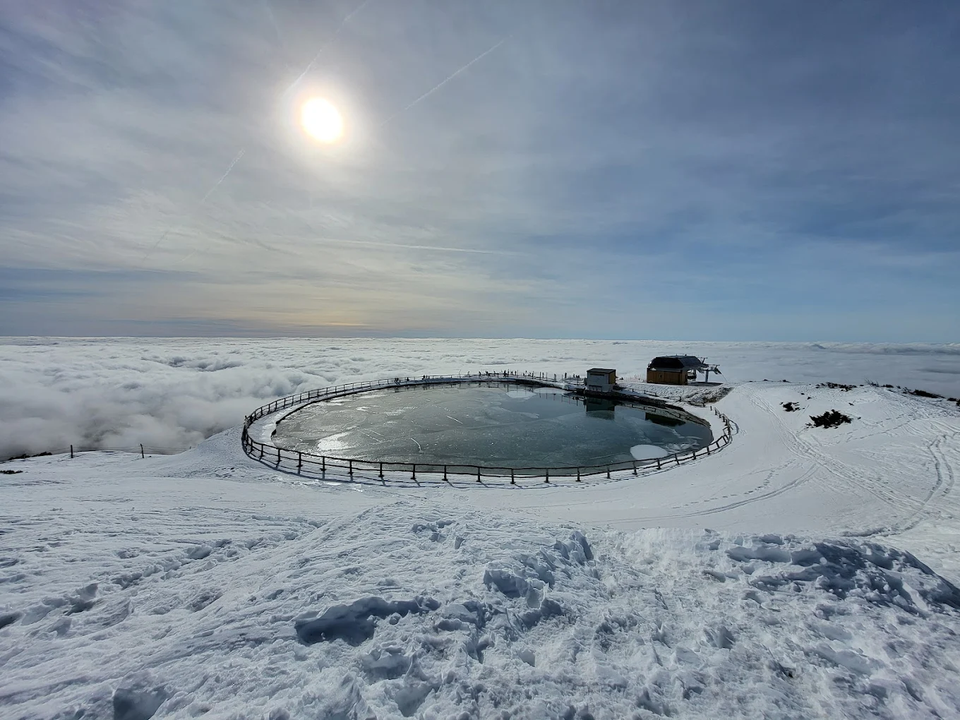 Krvavec in Slovenia - a hot pool in the middle of a snowy landscape.