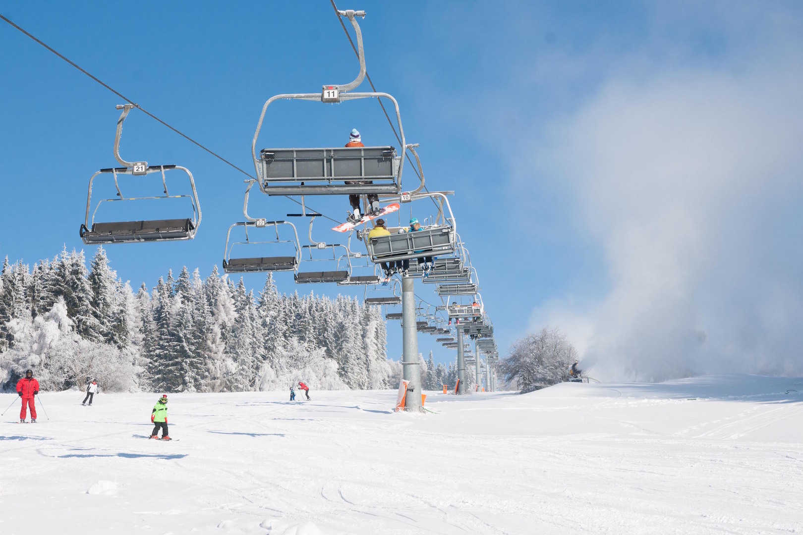 Stará Ves u Rýmařova in Czech Republic - a group of people riding a ski lift.