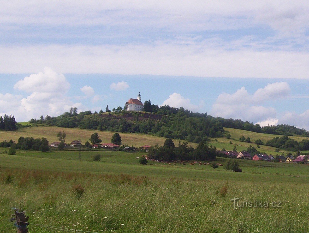 Stará Ves u Rýmařova in Czech Republic - a hill with a church on top of it.