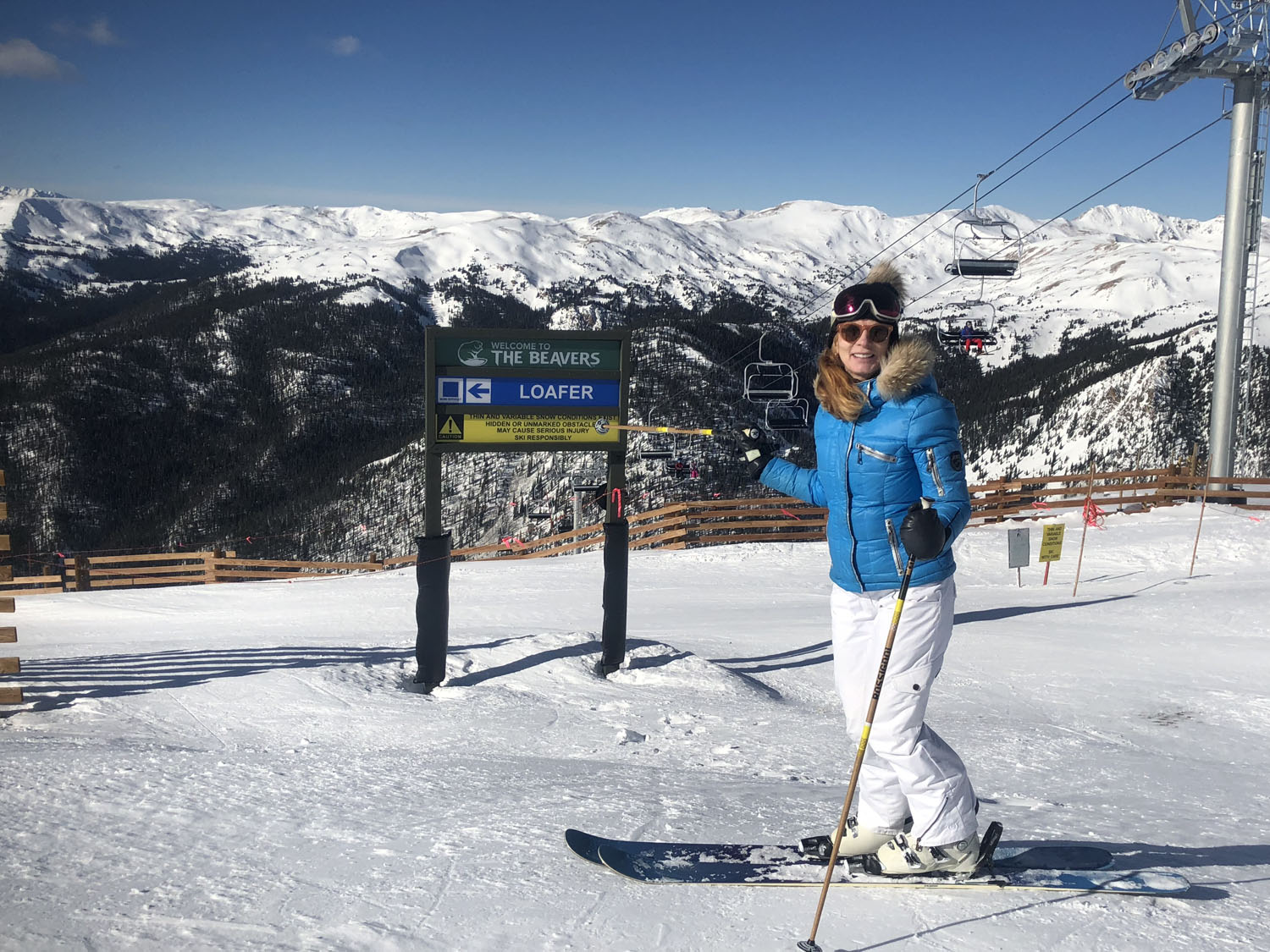 Watles – Malles Venosta in Italy - a woman standing on a snow covered ski slope.