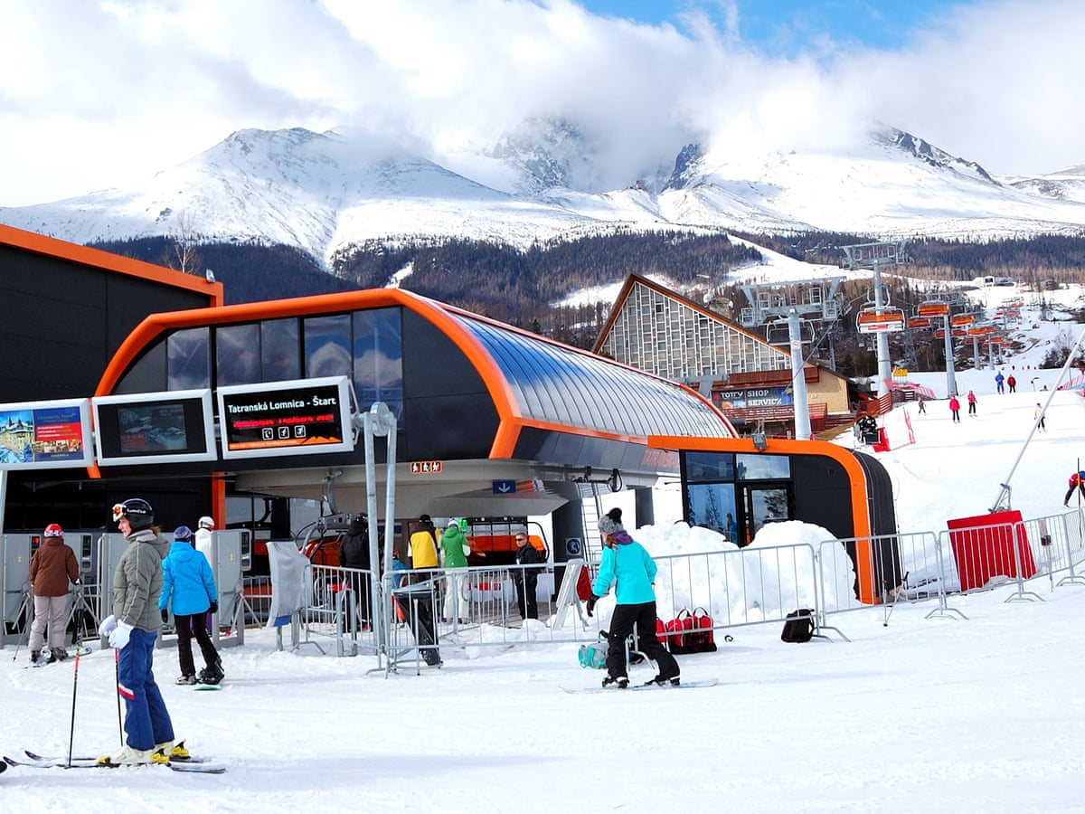 Tatranská Lomnica in Slovakia - a group of people skiing down a snowy slope.