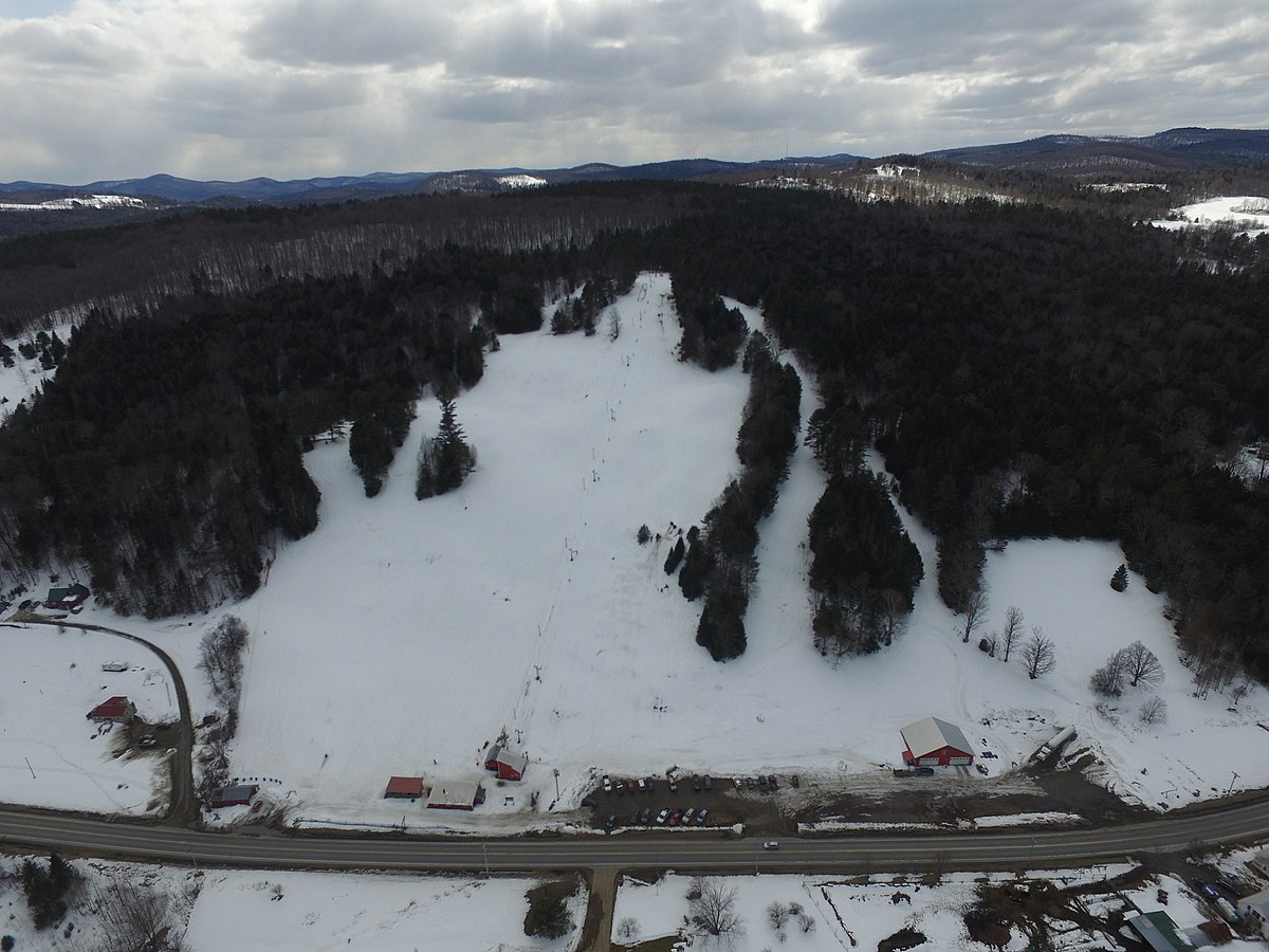 Northeast Slopes – East Corinth in USA - an aerial view of a snow covered road in the mountains.