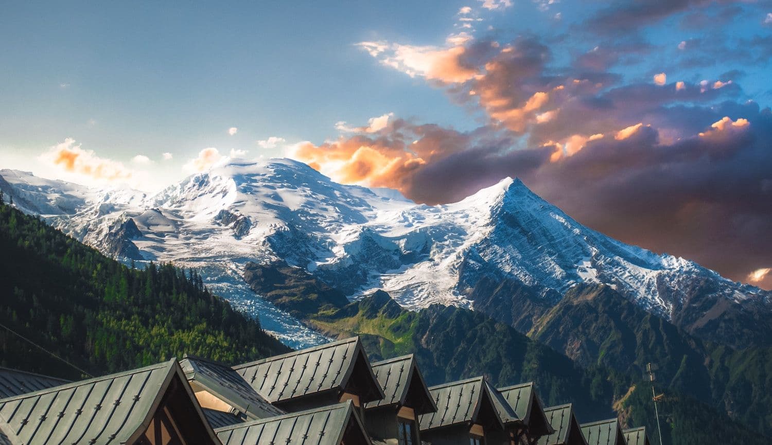 Rinerhorn in Switzerland - a view of a mountain range with houses in the fore.