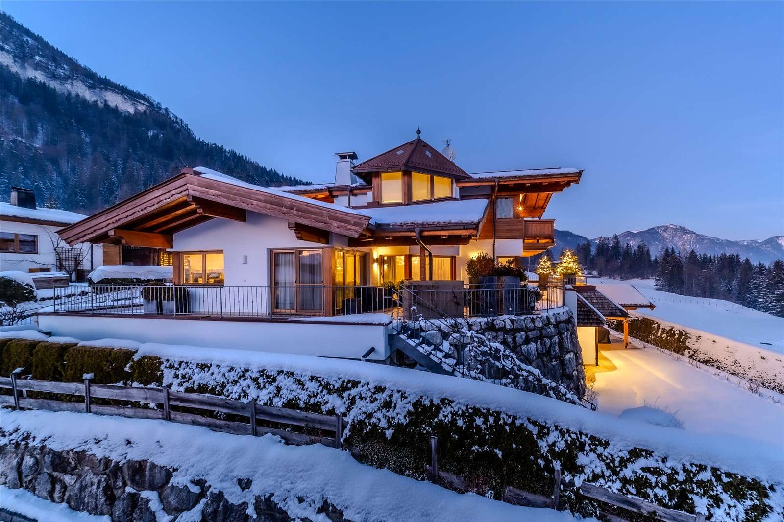 Kirchdorf in Austria - a house in the mountains covered in snow.