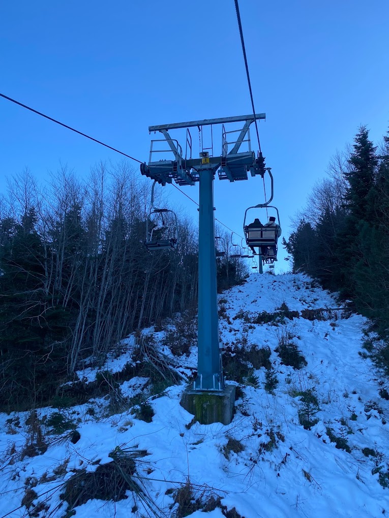 Olympus – Vryssopoules in Greece - a ski lift going up a snowy hill.