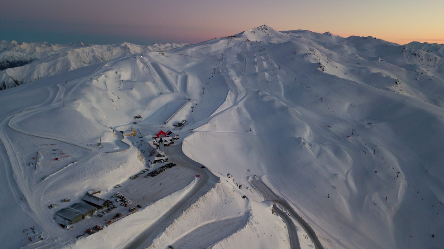 Treble Cone in New Zealand - a view from the top of a snowy mountain.