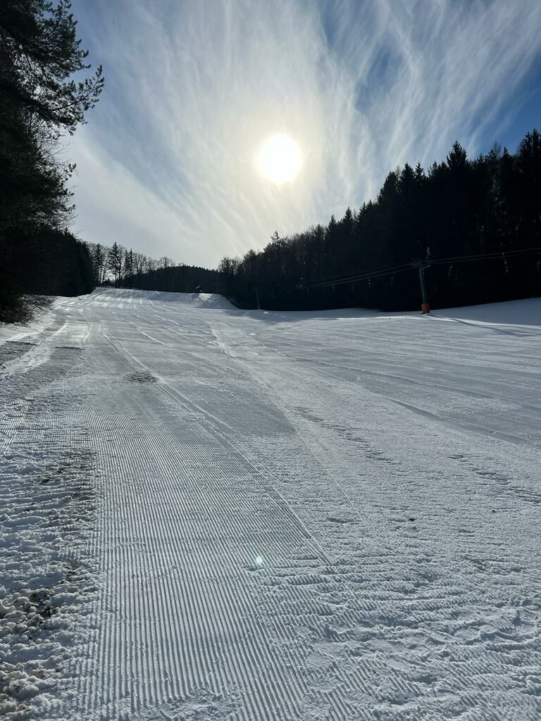 Brandlwiese – Kaumberg in Austria - a snow covered ski slope with trees in the background.
