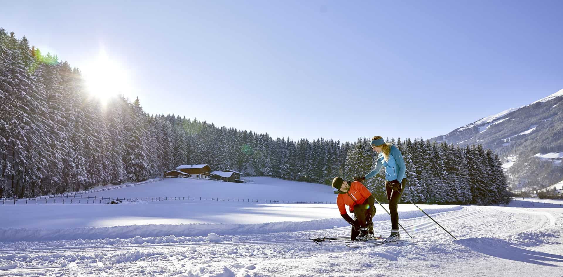 Wildkogel in Austria - a man and a woman cross country skiing.