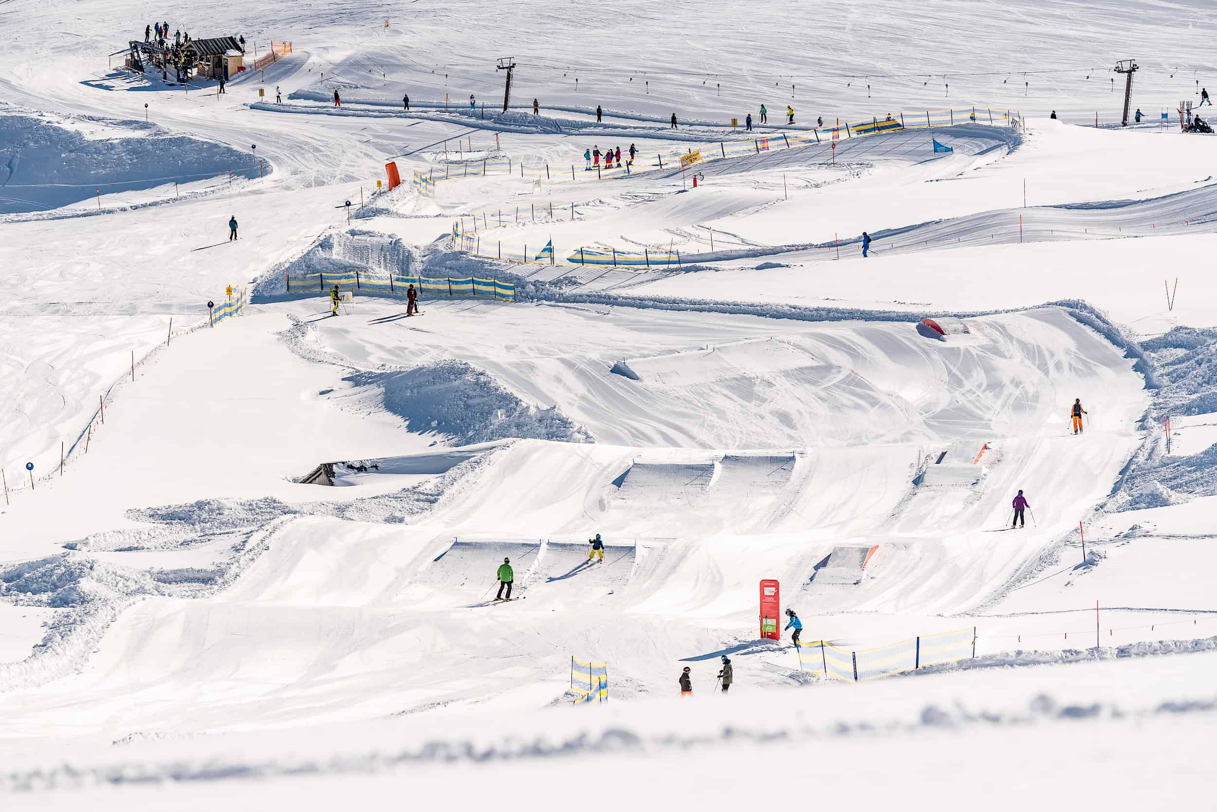 Wildkogel in Austria - a group of people skiing down a snowy slope.