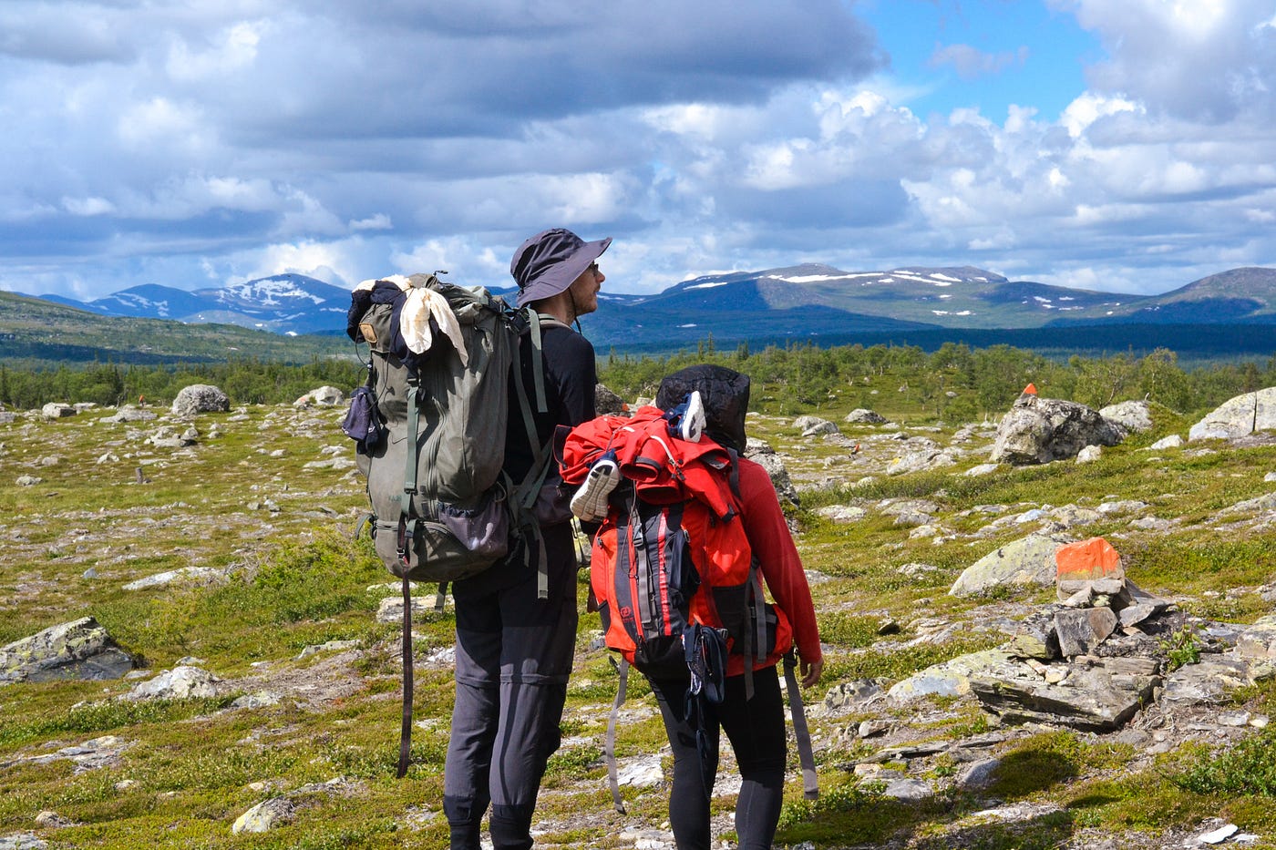 Vålådalens Fjällstation in Sweden - a couple of hikers on a rocky mountain.