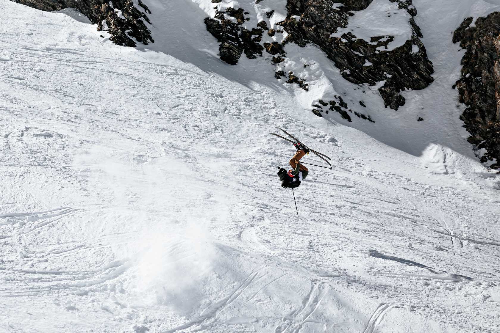 Valfréjus in France - a man is skiing down a snowy mountain.