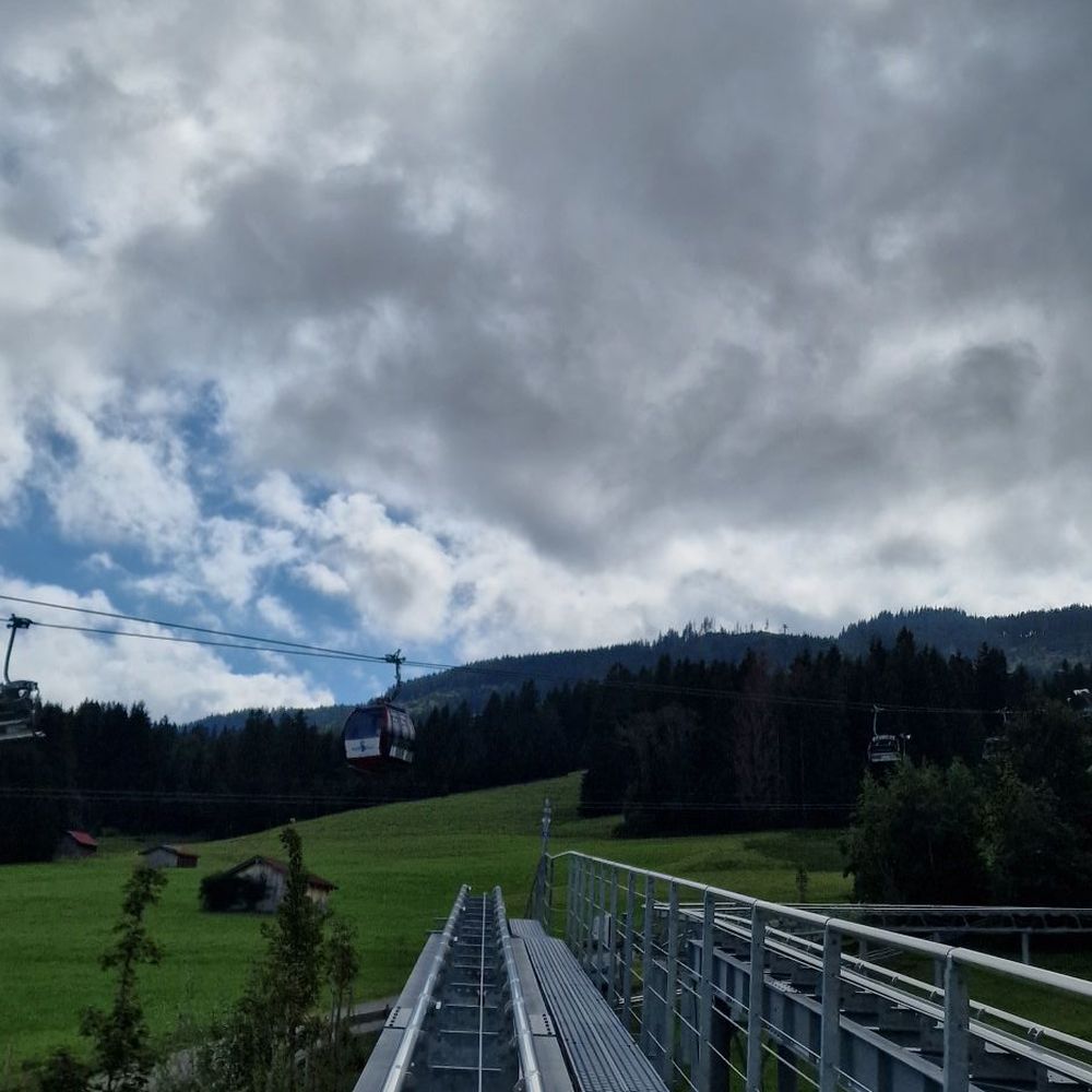 Luggi Leitner Lifts – Scheidegg in Germany - a ski lift going up a hill.