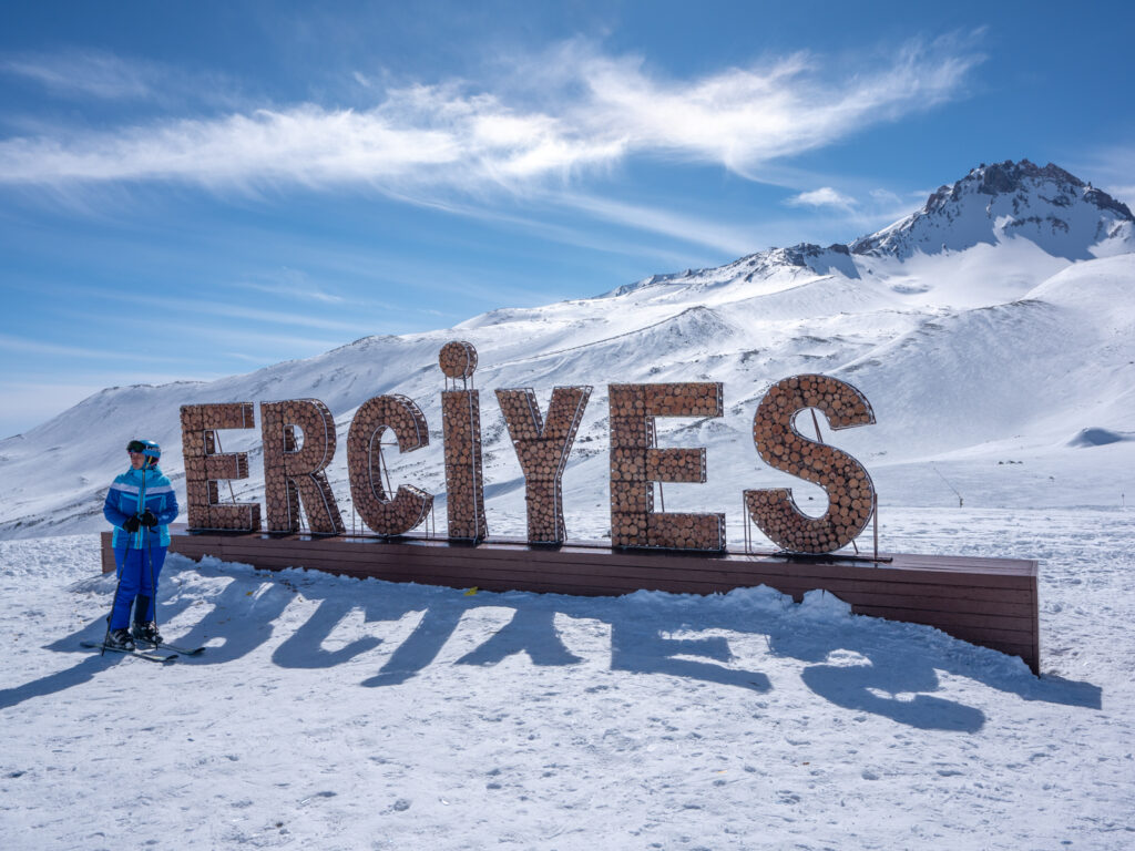 Ercİyes Ski Resort in Turkey - a person standing in front of a sign.
