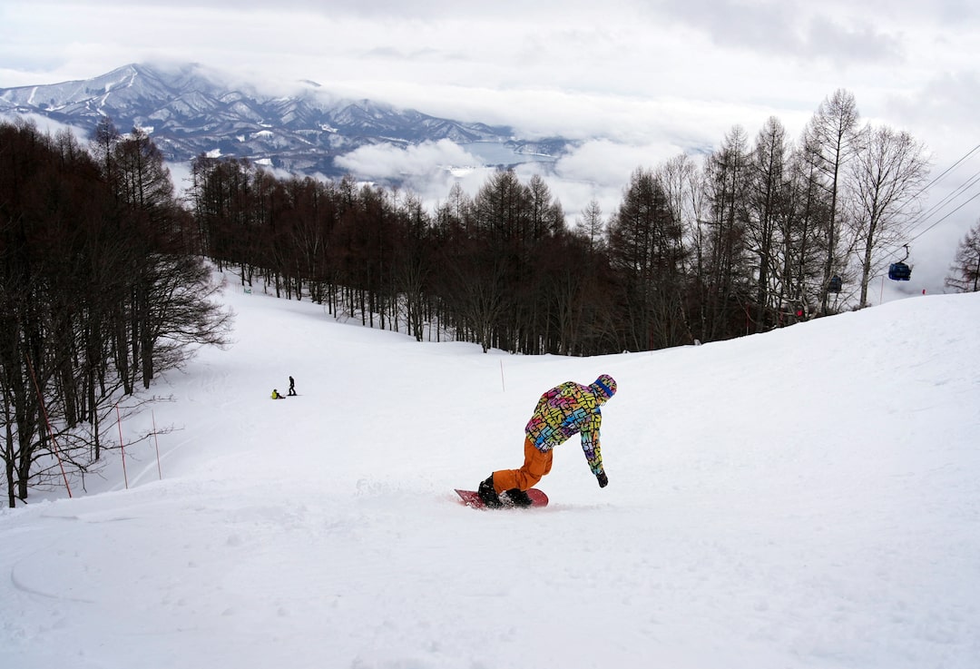 Myoko Suginohara in Japan - a person on a snowboard going down a hill.