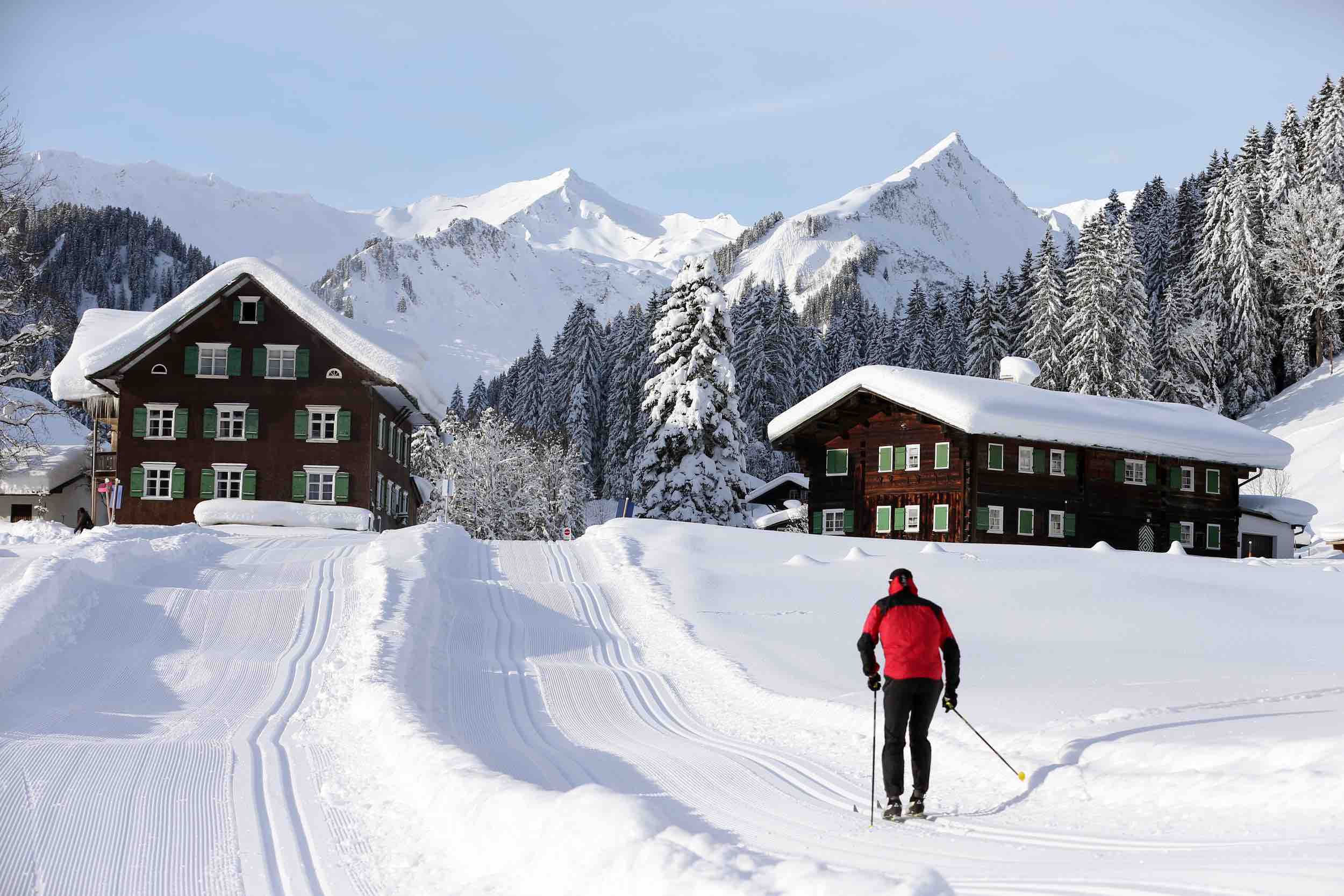 Winter sports enthusiasts enjoying the day at Walmendingerhorn, Heuberg in Mittelberg, Hirschegg, a popular ski resort in Bregenz, Vorarlberg, Austria amidst breathtaking winter scenery.