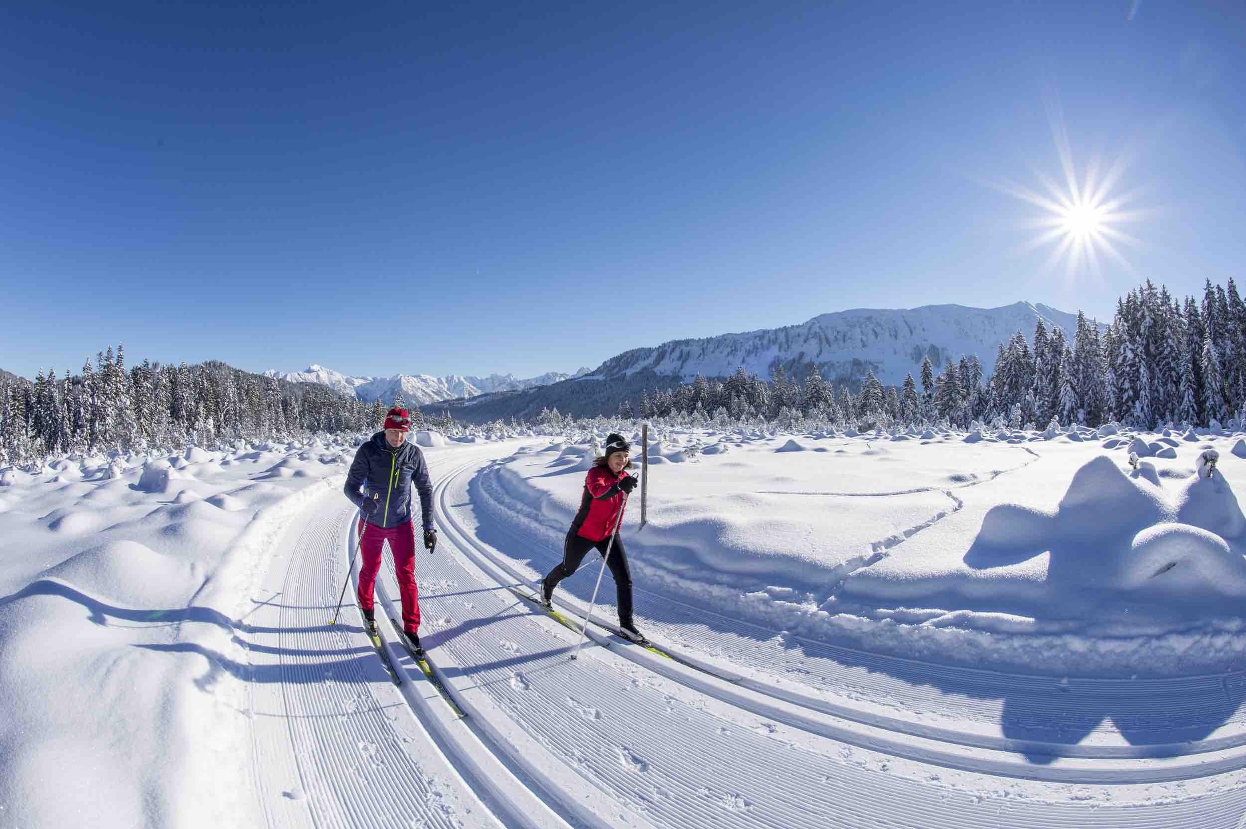 Enjoying a day of winter sports at Walmendingerhorn in Bregenz Austria a family skis down the slopes of this charming ski resort surrounded by beautifully maintained facilities and cozy chalets.