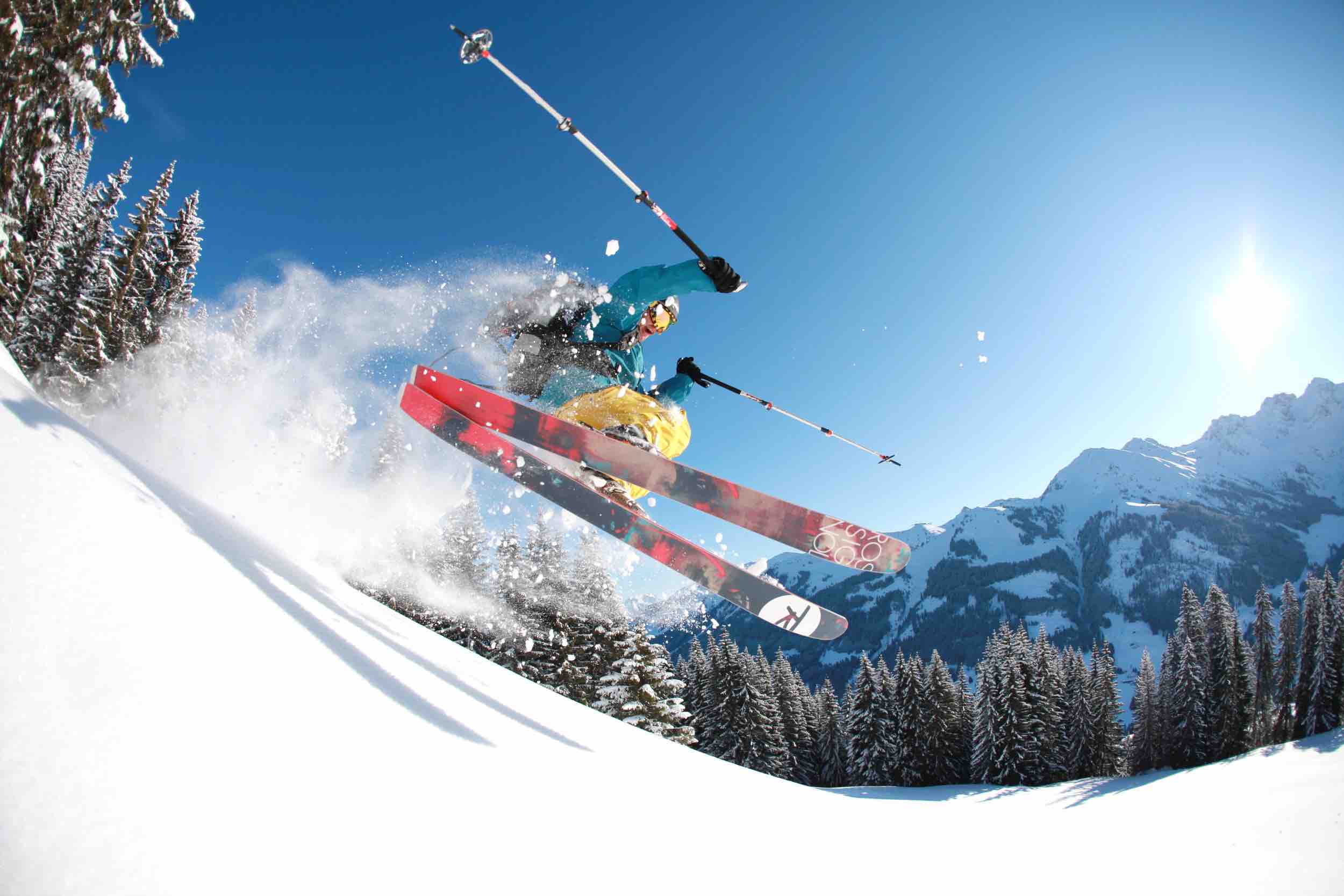 A skier enjoying a winter sports scene at the Walmendingerhorn Heuberg - Mittelberg Hirschegg ski resort in Bregenz Austria. Features include a ski lift and a sports centre.