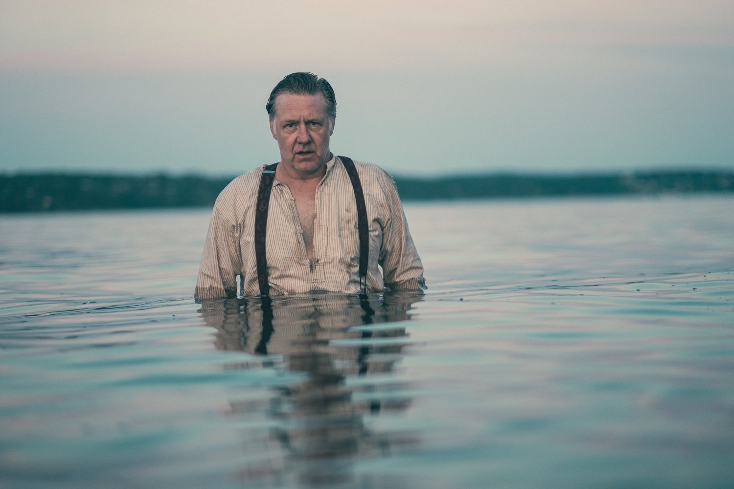 Dalseter – Espedalen in Norway - a man standing in the middle of a lake.