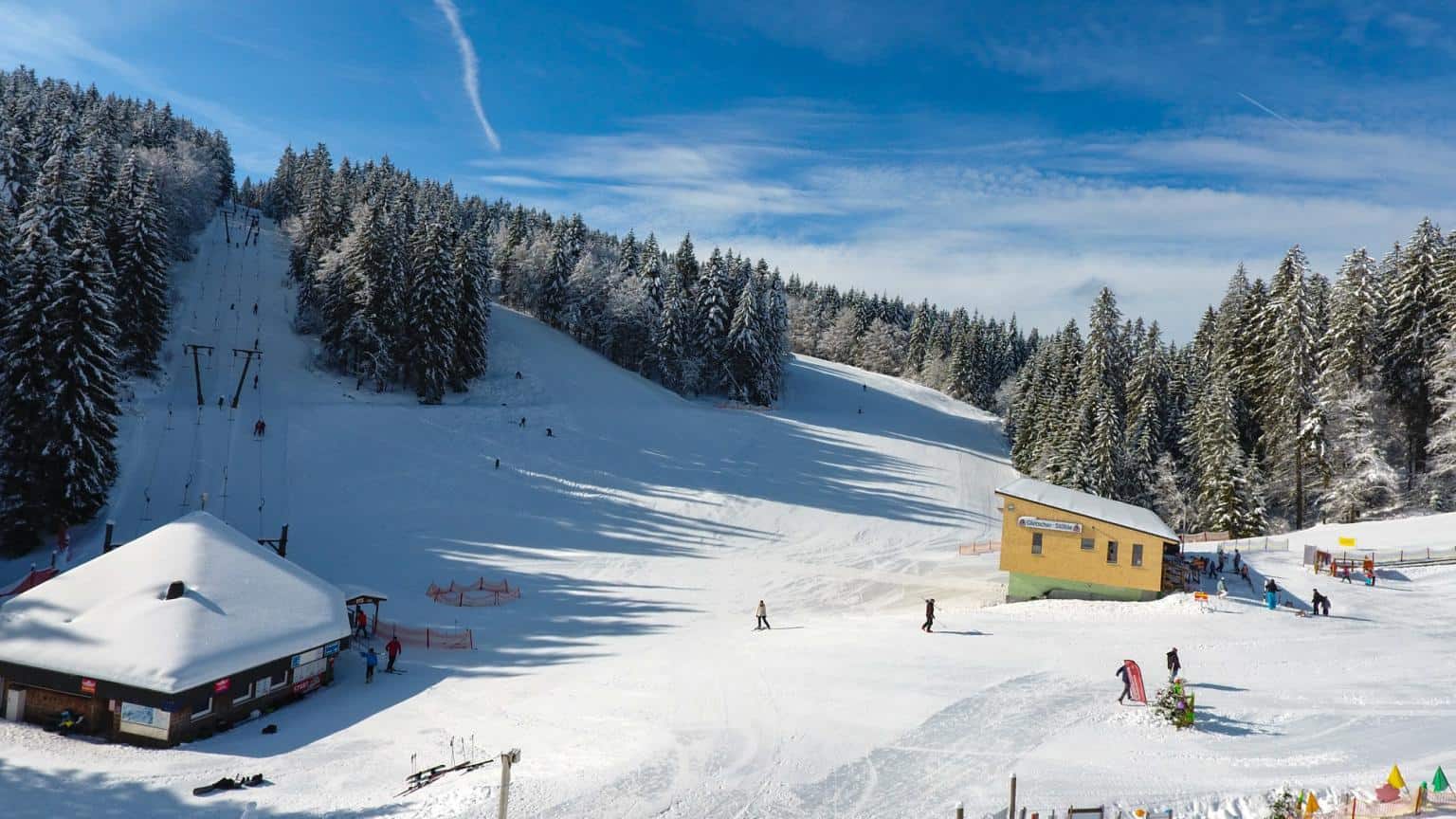 Notschrei in Germany - a group of people skiing down a snowy slope.