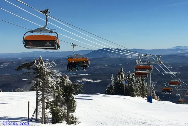 Okemo Mountain Resort in USA - a ski lift going up a snowy mountain.