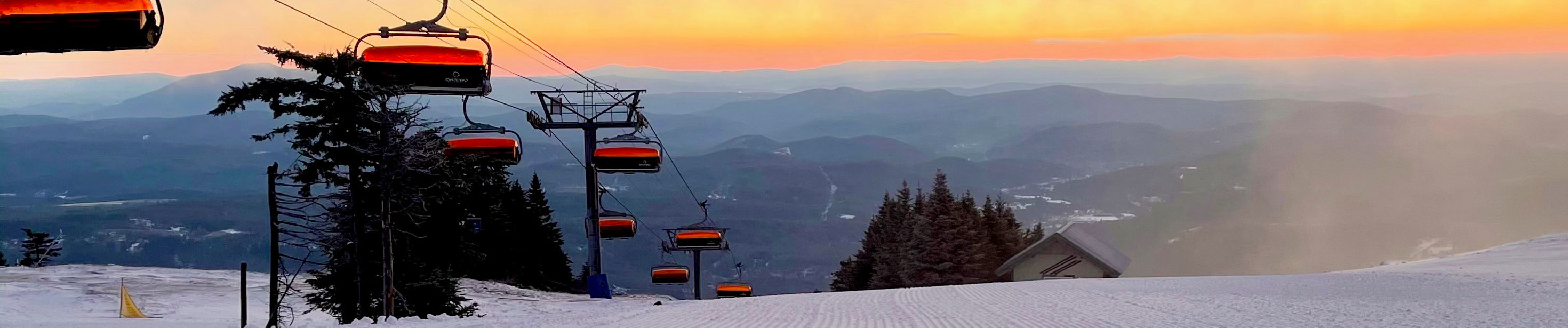 Okemo Mountain Resort in USA - a ski lift going up the side of a mountain.