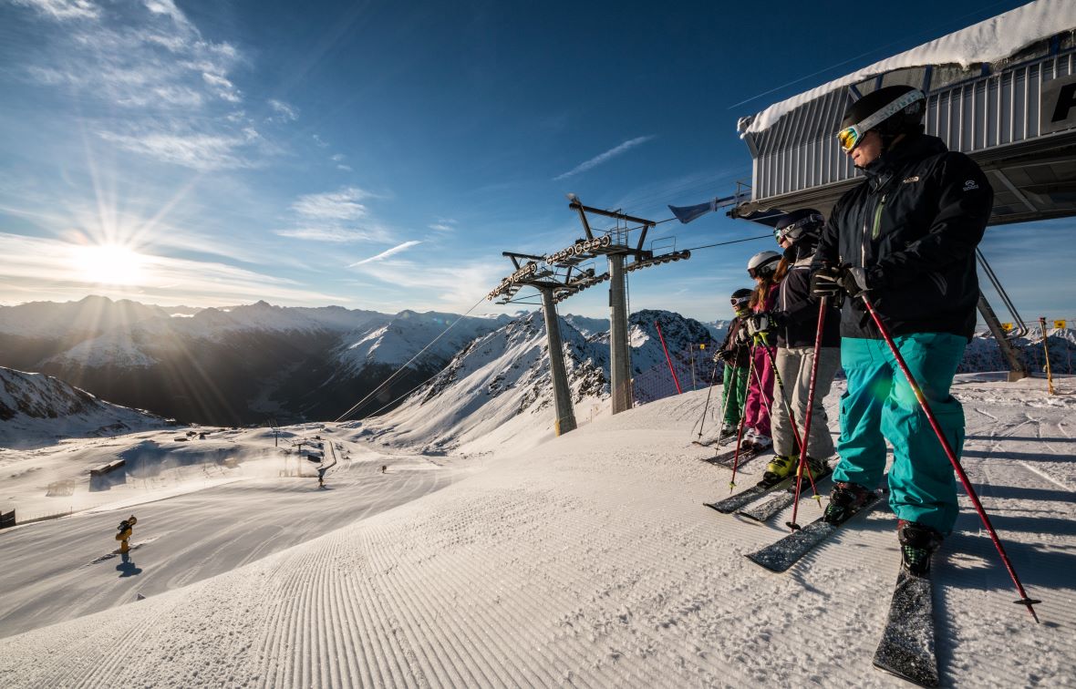Selfranga Davos Klosters in Switzerland - a group of skiers at the top of a mountain.