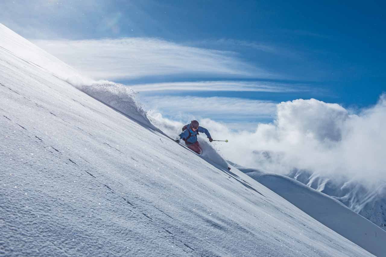 Selfranga Davos Klosters in Switzerland - a person skiing down a snow covered mountain.