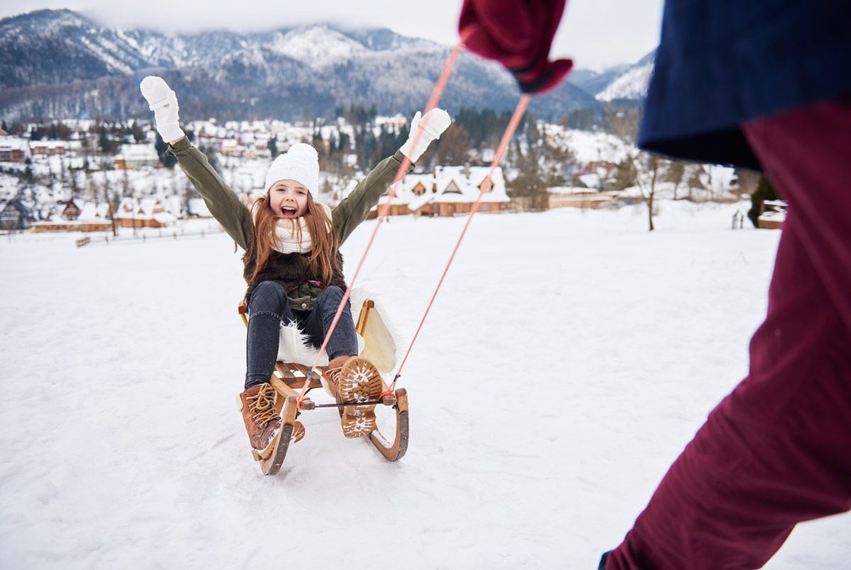Ellegglifte – Faistenoy in Germany - a little girl on a sler in the snow.