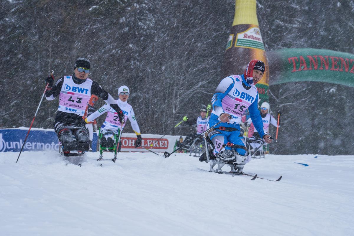 Rothaus in Germany - a group of skiers racing down a snowy slope.