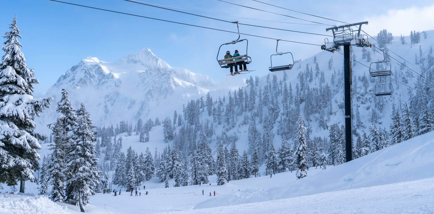 Mt Baker in USA - a ski lift going up a snowy mountain.