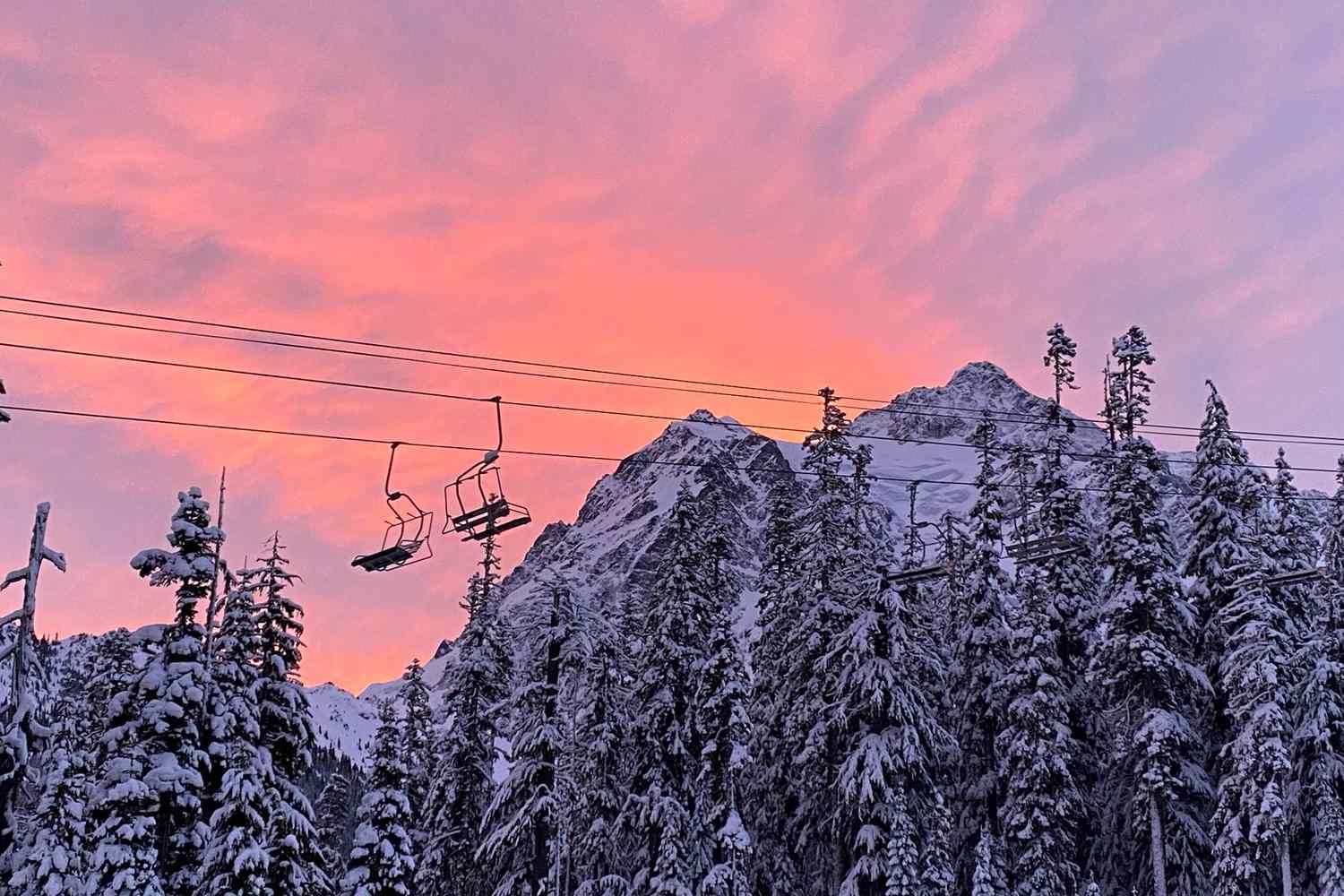 Mt Baker in USA - a ski lift going up a snowy mountain.