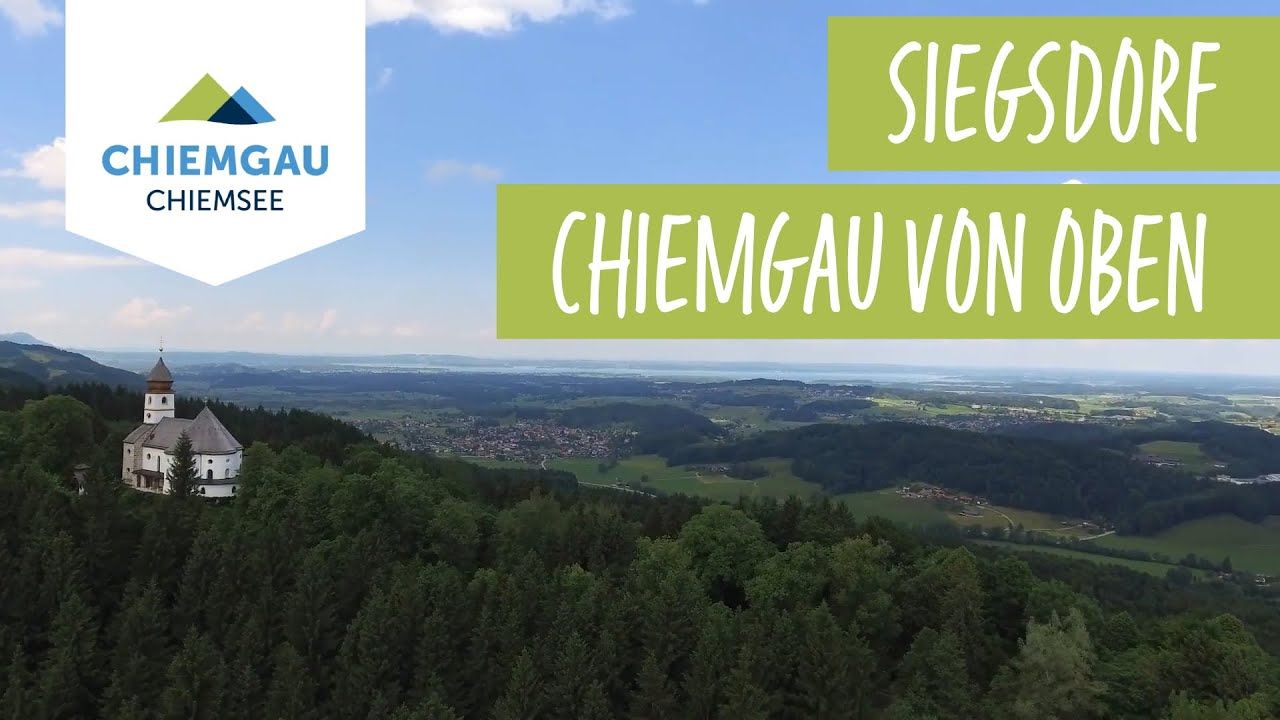 Wolfsberglift – Siegsdorf in Germany - a church on top of a mountain with the words chese in the background.