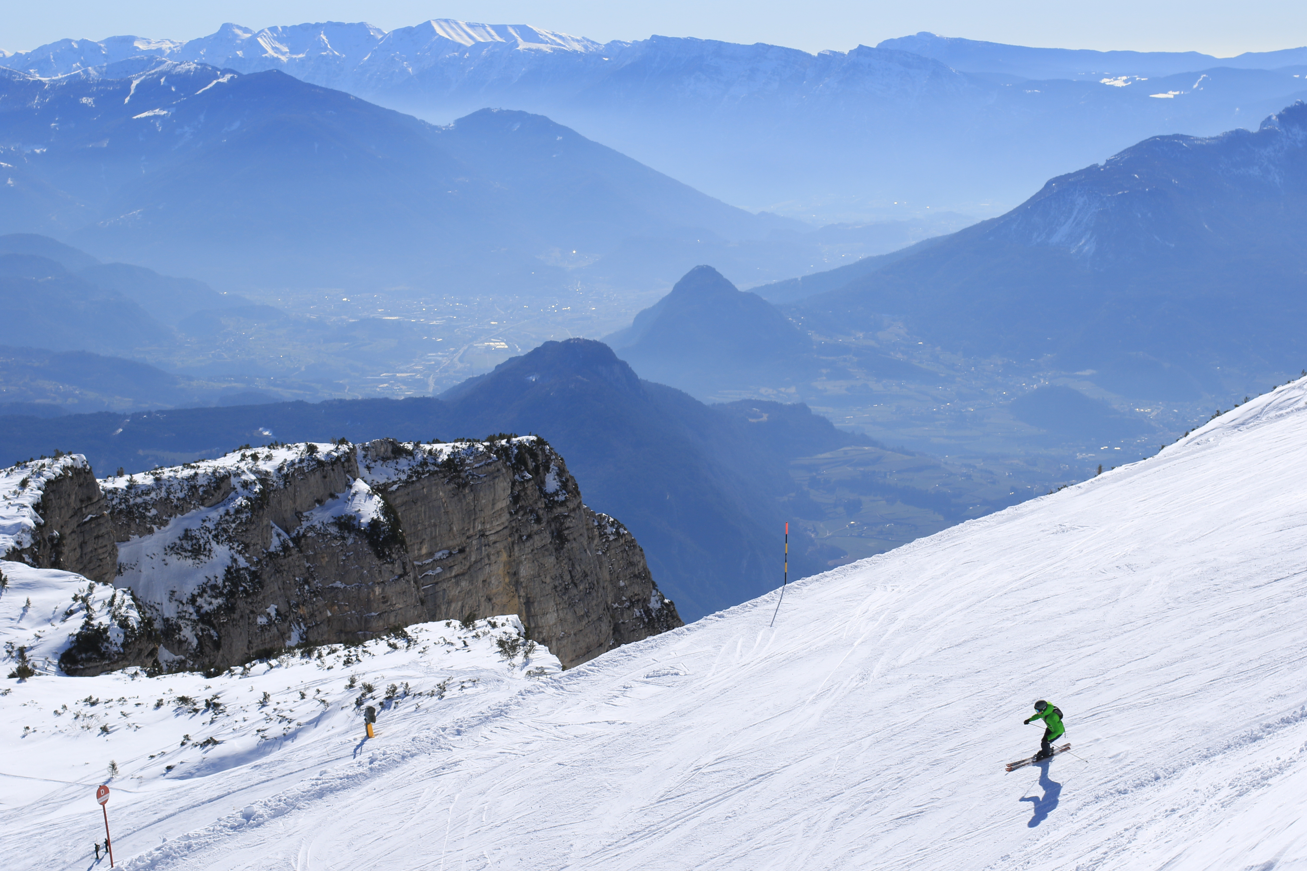 Paganella – Andalo in Italy - a person skiing down a snowy mountain.