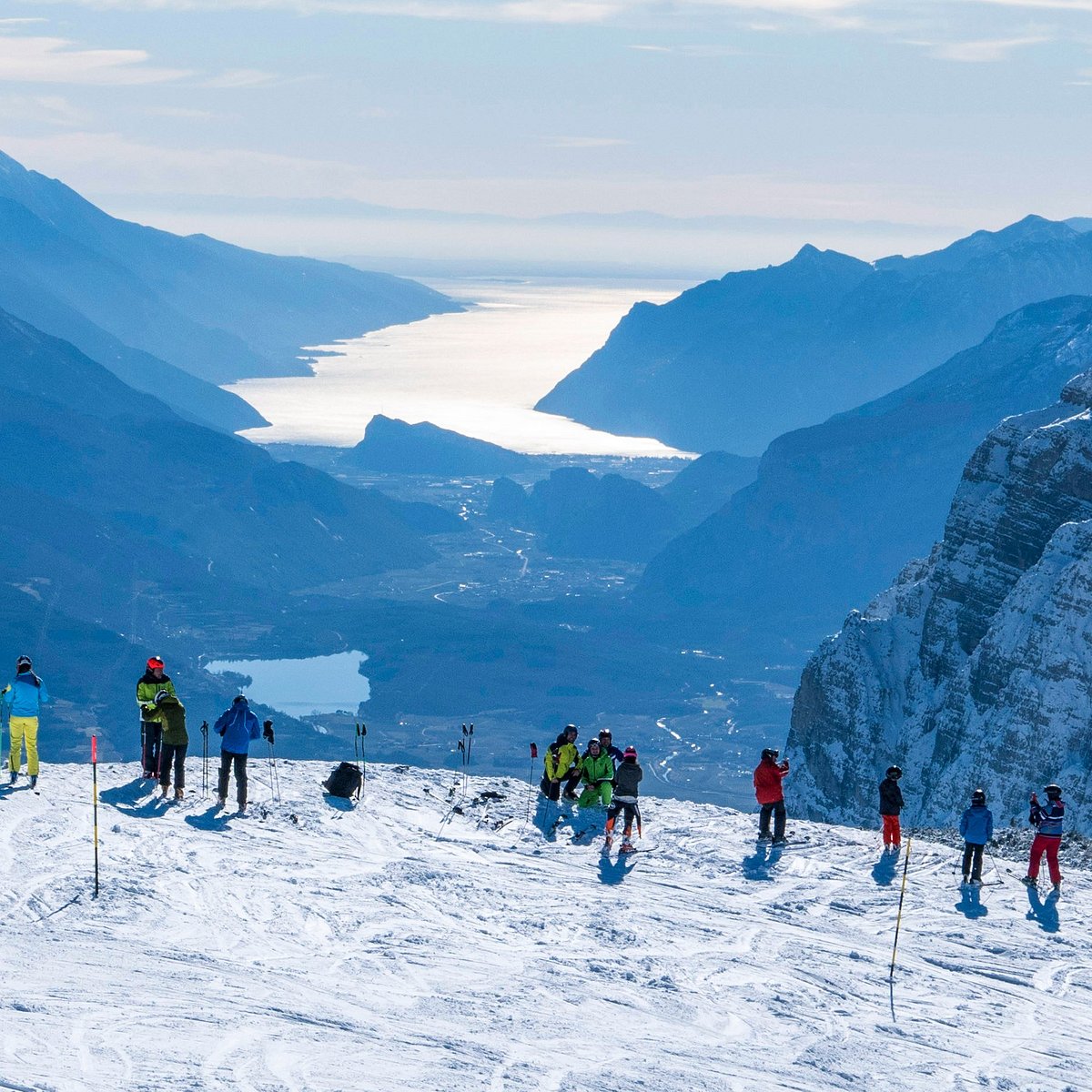 Paganella – Andalo in Italy - a group of people standing on top of a mountain.
