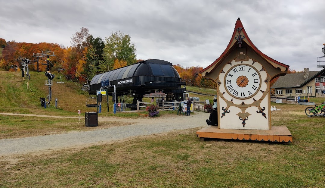 Mount Snow in USA - a clock sits on the side of a hill.