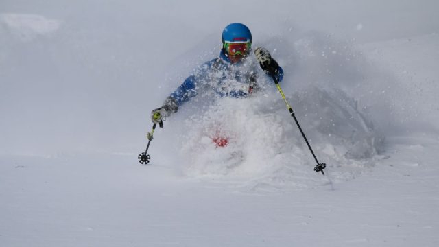 A skier enjoying a sunny day on the snowy slopes of Wurzeralm – Spital am Pyhrn in Steyr-Kirchdorf, Upper Austria