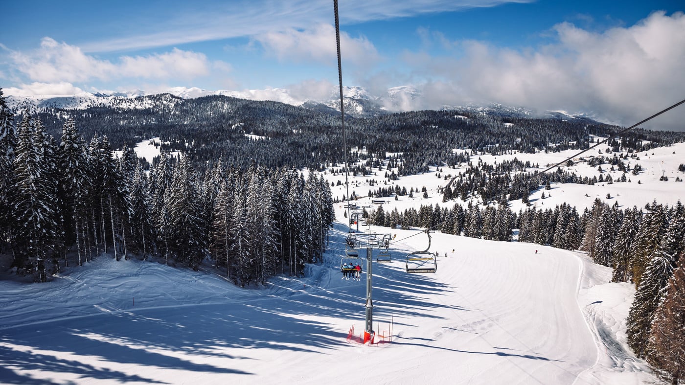Alpe Cimbra | Lavarone in Italy - a ski lift going down a snowy slope.
