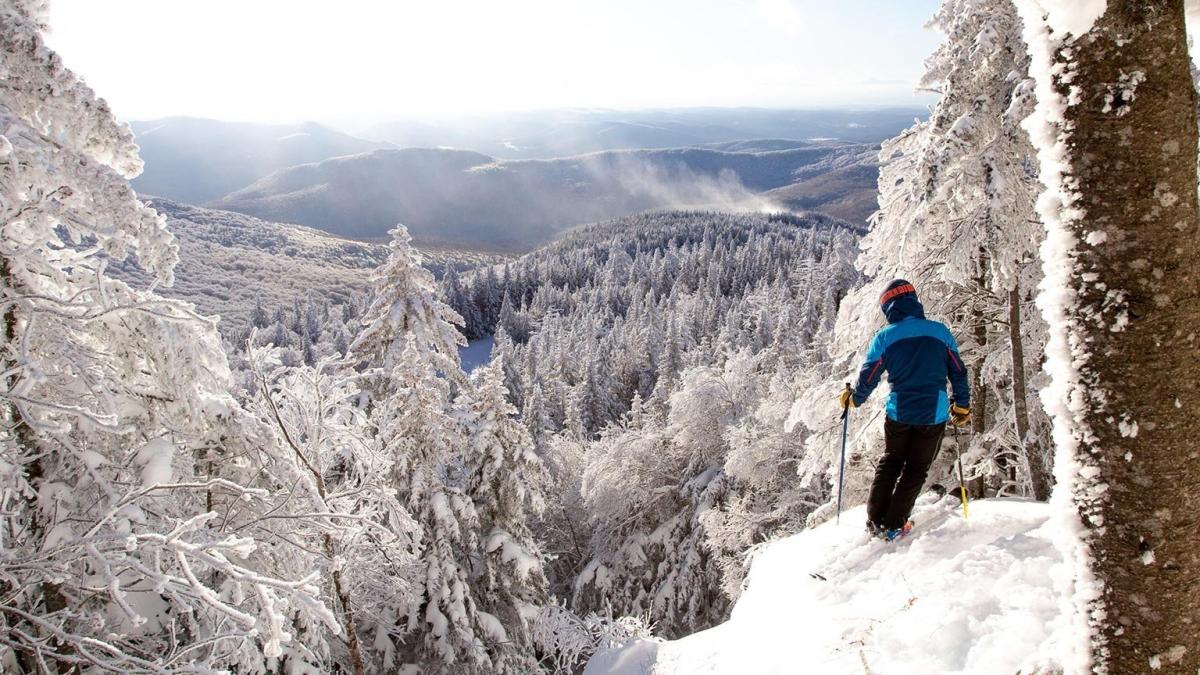 Bolton Valley in USA - a person on skis on a snowy mountain.